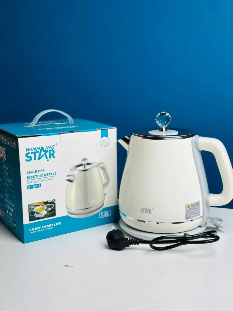 Winning Star ST-6016 stainless steel and plastic electric kettle on its base.